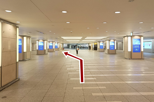 Continue straight and turn left at the end of the corridor.